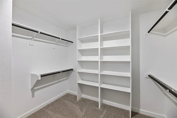 a view of an empty walk in closet