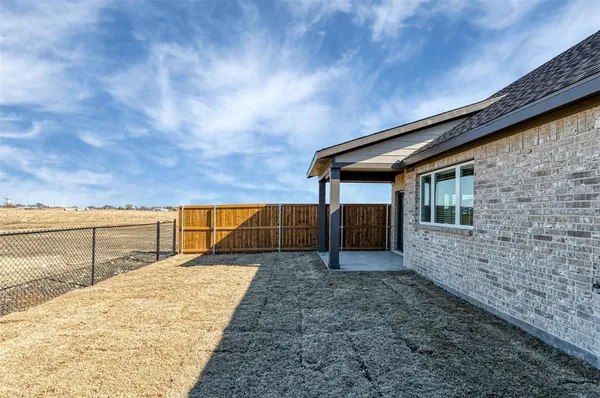 a backyard of a house with wooden floor