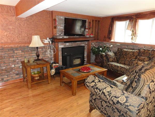 12 Weathervane Road Billerica, MA 01821 - Photo 11 of 30 a living room with furniture and a fireplace