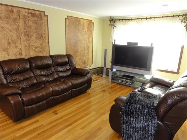 12 Weathervane Road Billerica, MA 01821 - Photo 8 of 30 a living room with furniture and a flat screen tv