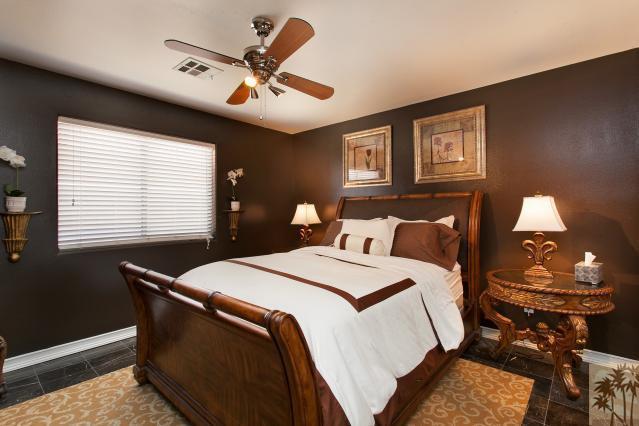 68130 Perlita Road Cathedral City, CA 92234 - Photo 14 of 19 a bed room with a bed and a ceiling fan