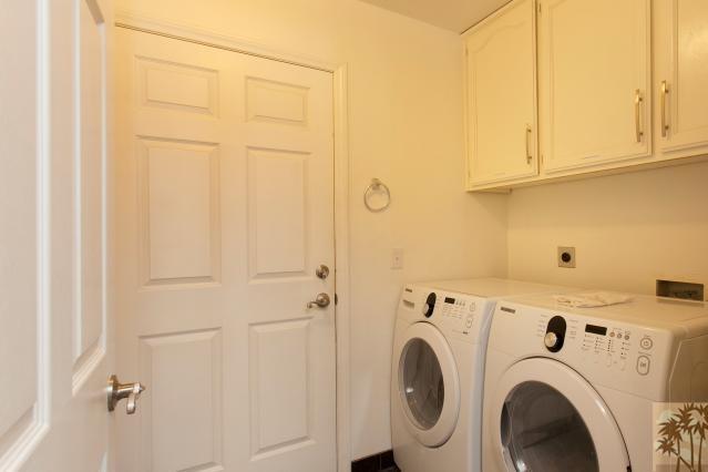 68130 Perlita Road Cathedral City, CA 92234 - Photo 15 of 19 a view of storage and utility room with washer and dryer