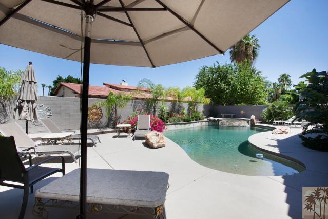 68130 Perlita Road Cathedral City, CA 92234 - Photo 17 of 19 a view of a patio with swimming pool table and chairs
