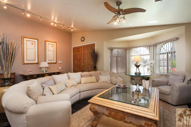 68130 Perlita Road Cathedral City, CA 92234 - Photo 2 of 19 a living room with furniture and a large window