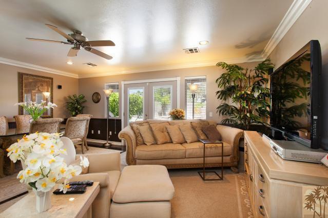 68130 Perlita Road Cathedral City, CA 92234 - Photo 7 of 19 a living room with furniture ceiling fan and a rug