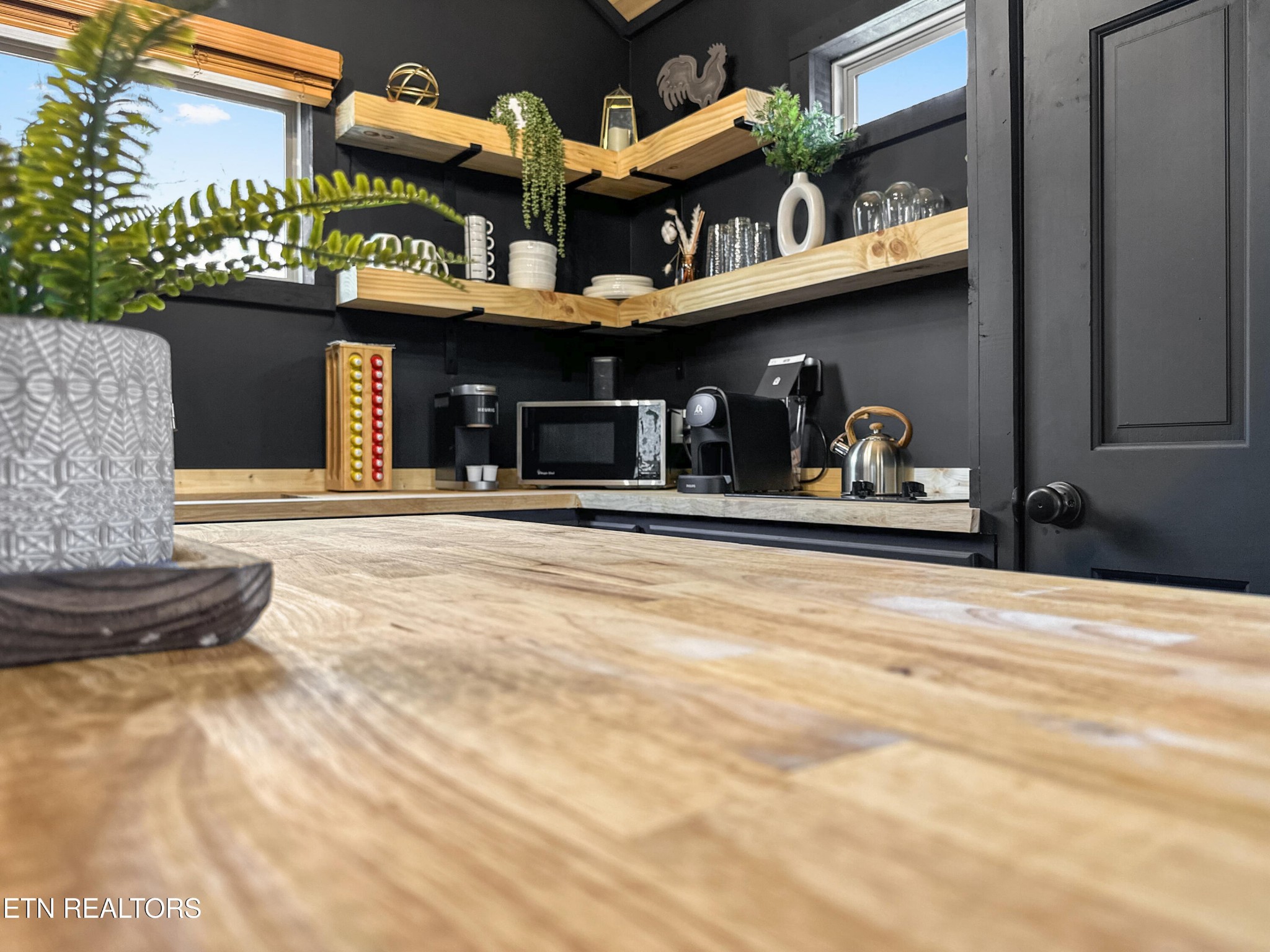 1079 Shell Mountain Road Sevierville, TN 37876 - Photo 17 of 29 a front view of a building with retail shops