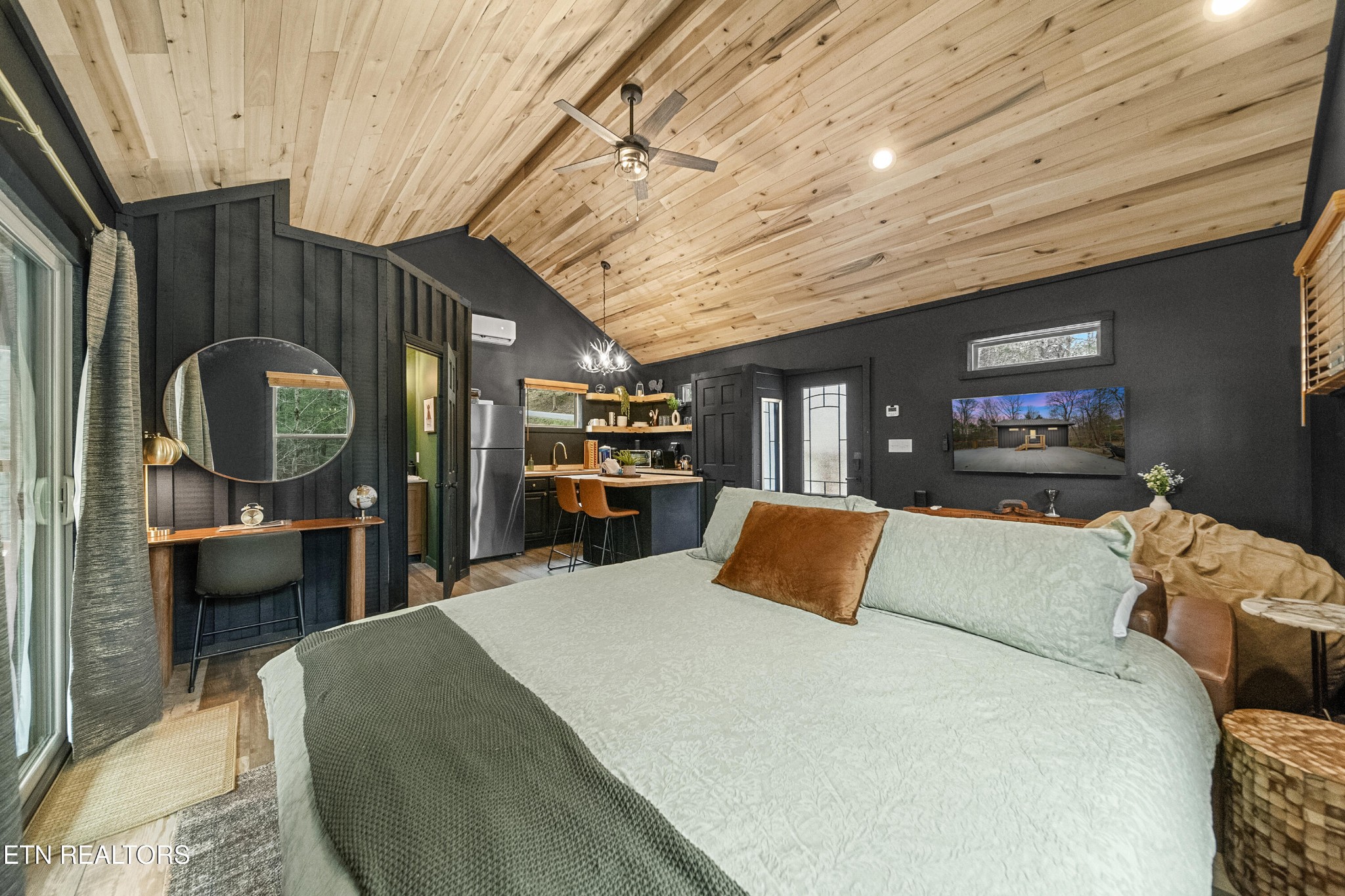 1079 Shell Mountain Road Sevierville, TN 37876 - Photo 19 of 29 a bed room with furniture and a mirror