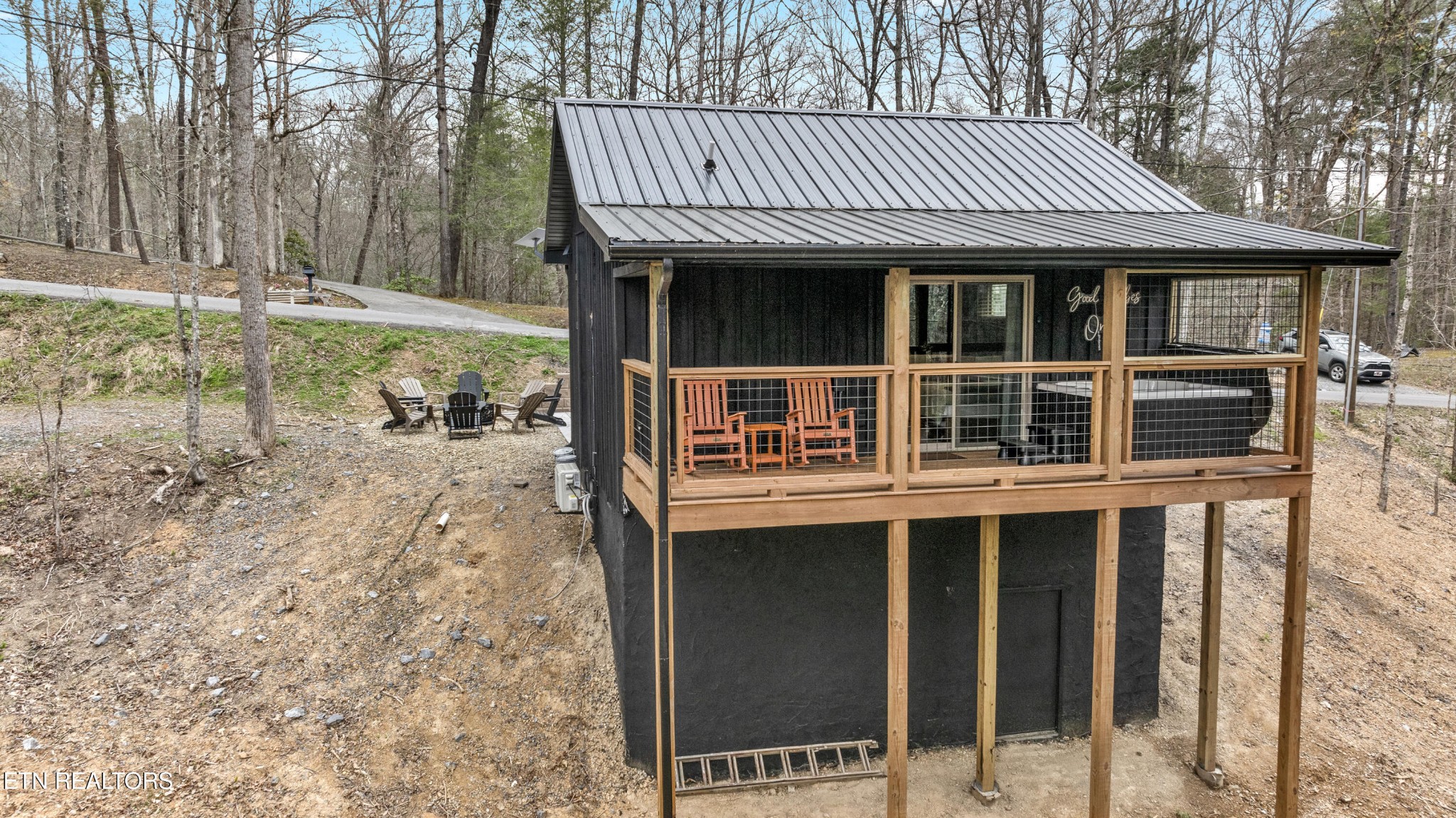 1079 Shell Mountain Road Sevierville, TN 37876 - Photo 25 of 29 a view of a house with backyard porch and sitting area