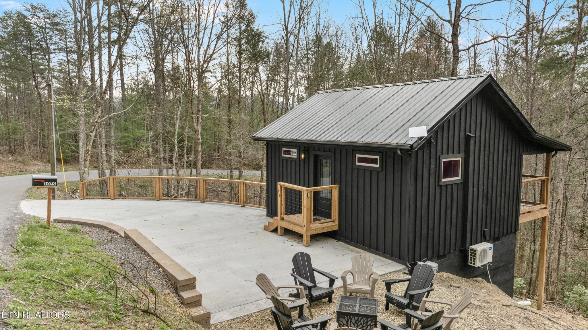 1079 Shell Mountain Road Sevierville, TN 37876 - Photo 26 of 29 a house with trees in the background