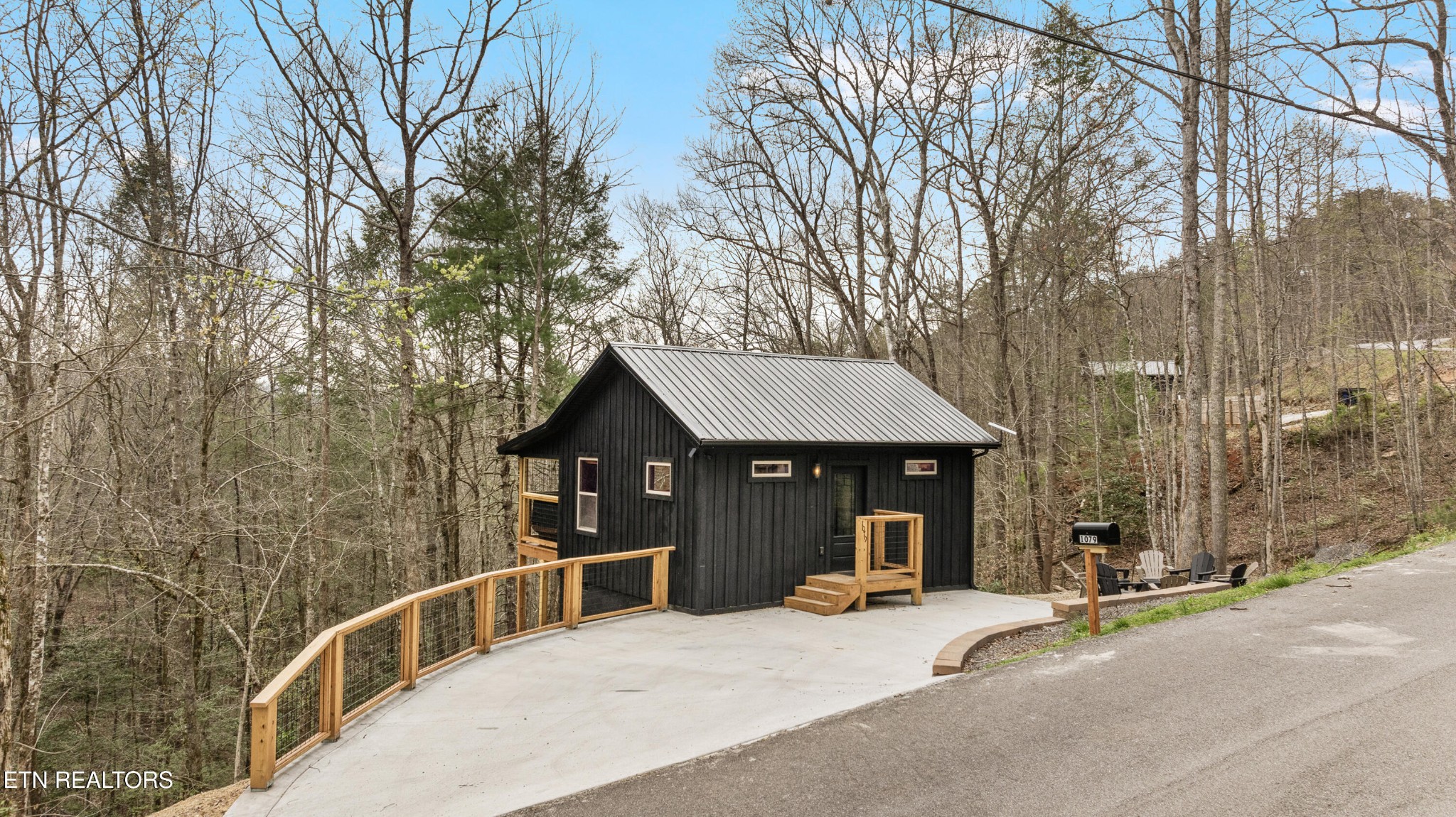 1079 Shell Mountain Road Sevierville, TN 37876 - Photo 27 of 29 a front view of a house with yard and trees around