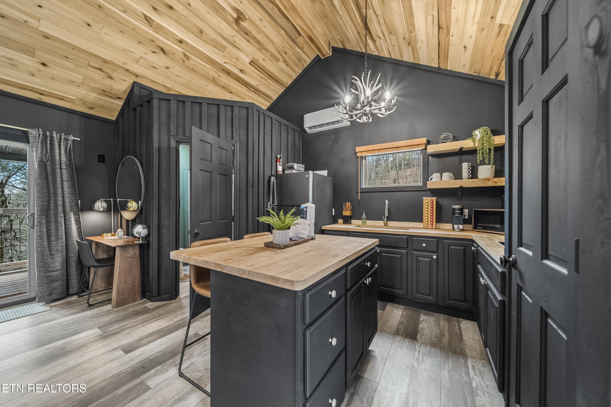 1079 Shell Mountain Road Sevierville, TN 37876 - Photo 6 of 29 a kitchen with a stove a refrigerator and a sink