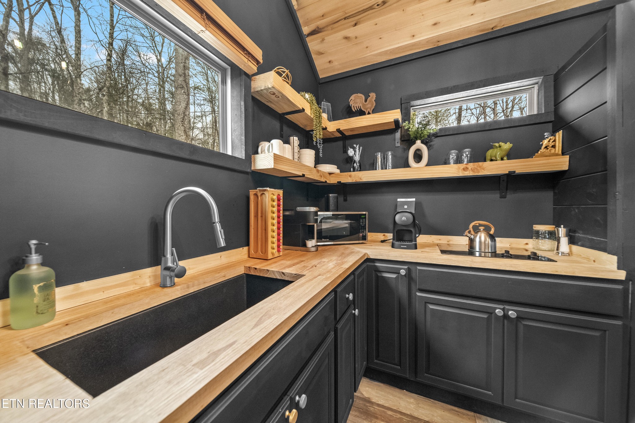 1079 Shell Mountain Road Sevierville, TN 37876 - Photo 7 of 29 a kitchen with a sink and cabinets