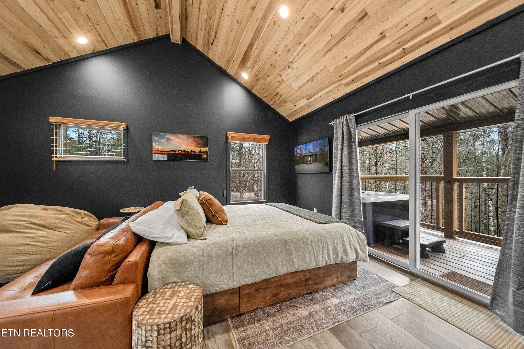 1079 Shell Mountain Road Sevierville, TN 37876 - Photo 8 of 29 a bedroom with a bed and a large window