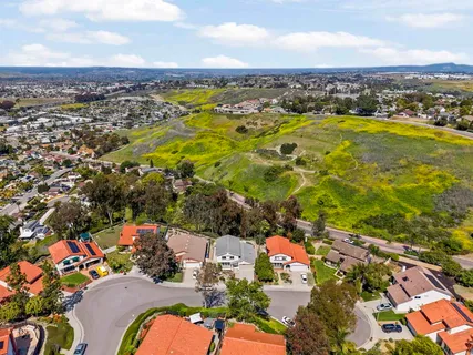 an aerial view of residential houses with outdoor space