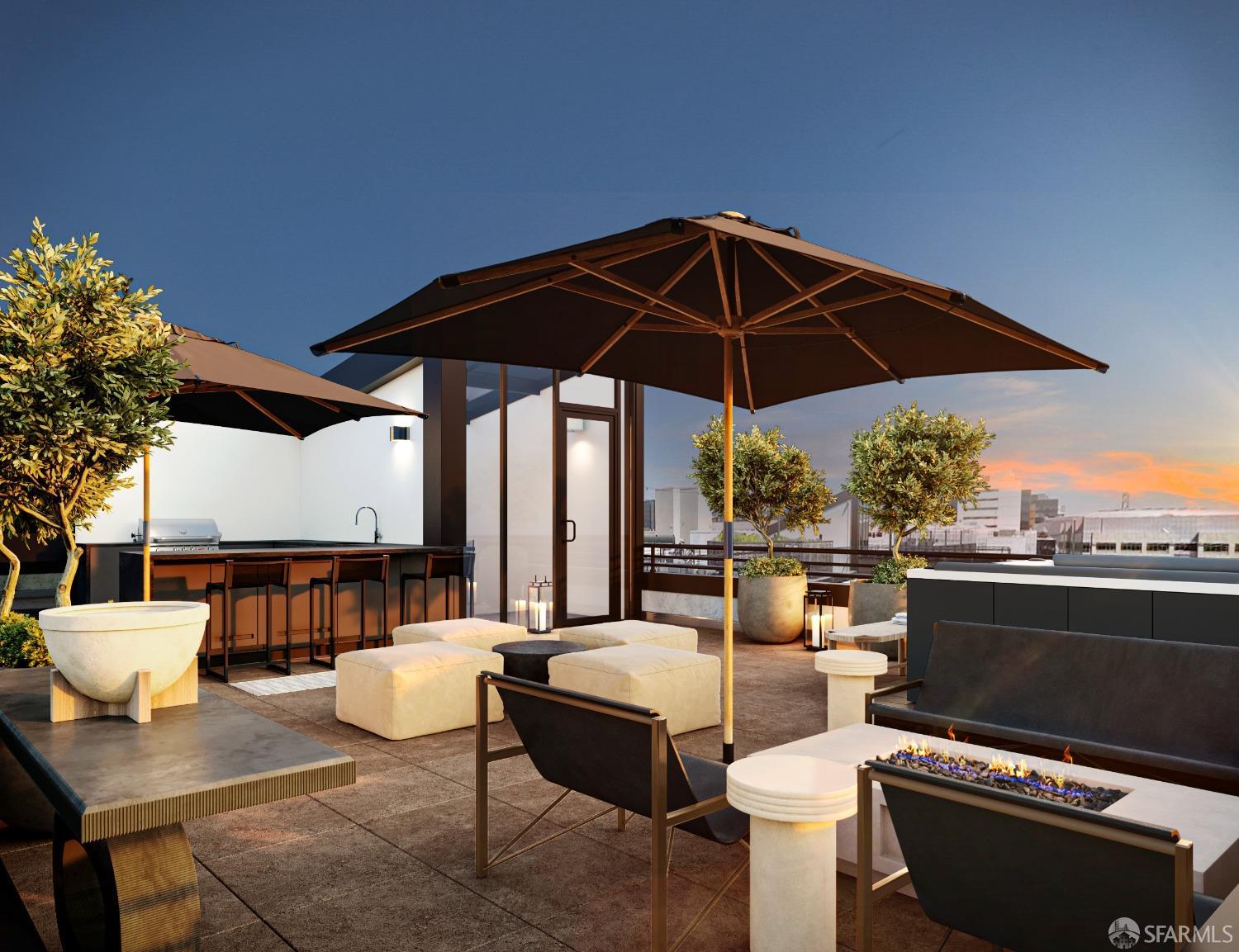 2177 3rd Street, Unit 721 San Francisco, CA 94107 - Photo 25 of 27 a patio with a table and chairs under an umbrella