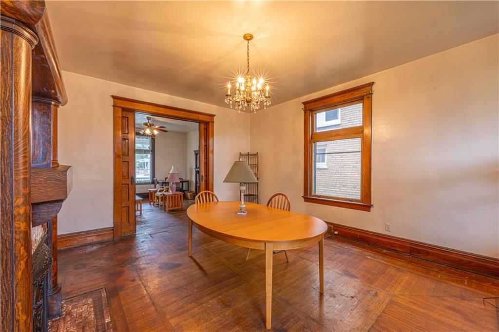 114 Union Street Uniontown, PA 15401 - Photo 8 of 28 a dining room with chandelier and wooden floor