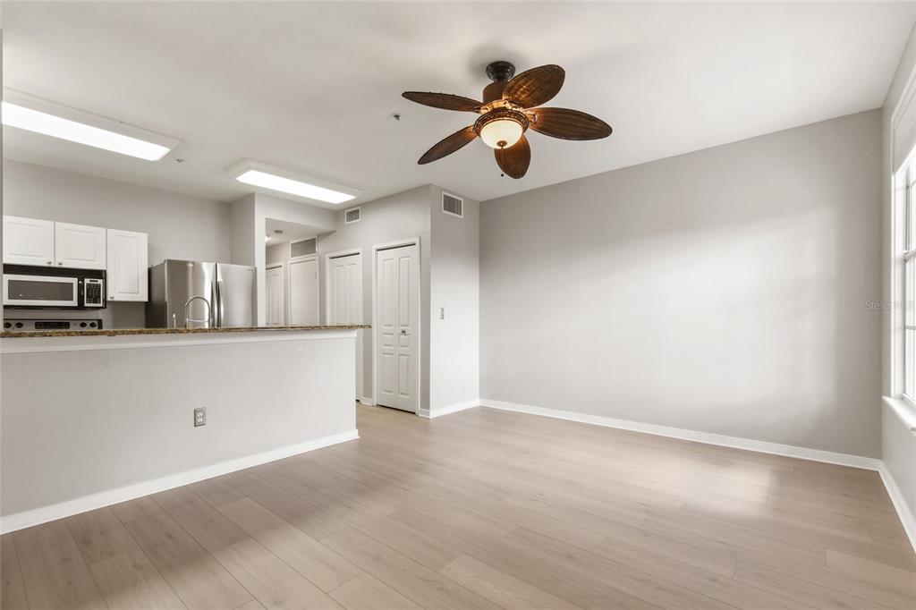 600 Market Street, Unit 340 Celebration, FL 34747 - Photo 15 of 35 a view of a kitchen with stainless steel appliances a refrigerator counter space and a window