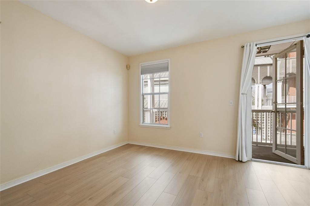 600 Market Street, Unit 340 Celebration, FL 34747 - Photo 17 of 35 an empty room with wooden floor and windows