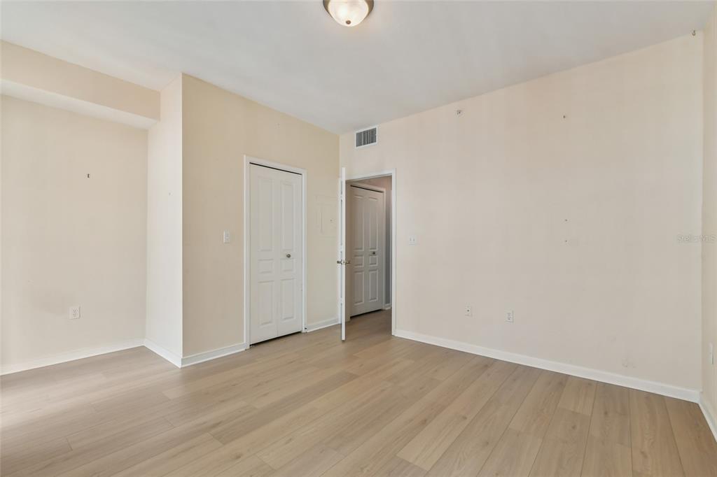 600 Market Street, Unit 340 Celebration, FL 34747 - Photo 18 of 35 a view of an empty room with wooden floor