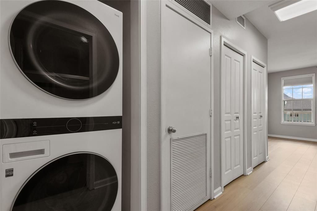 600 Market Street, Unit 340 Celebration, FL 34747 - Photo 21 of 35 a view of a hallway with washer and dryer