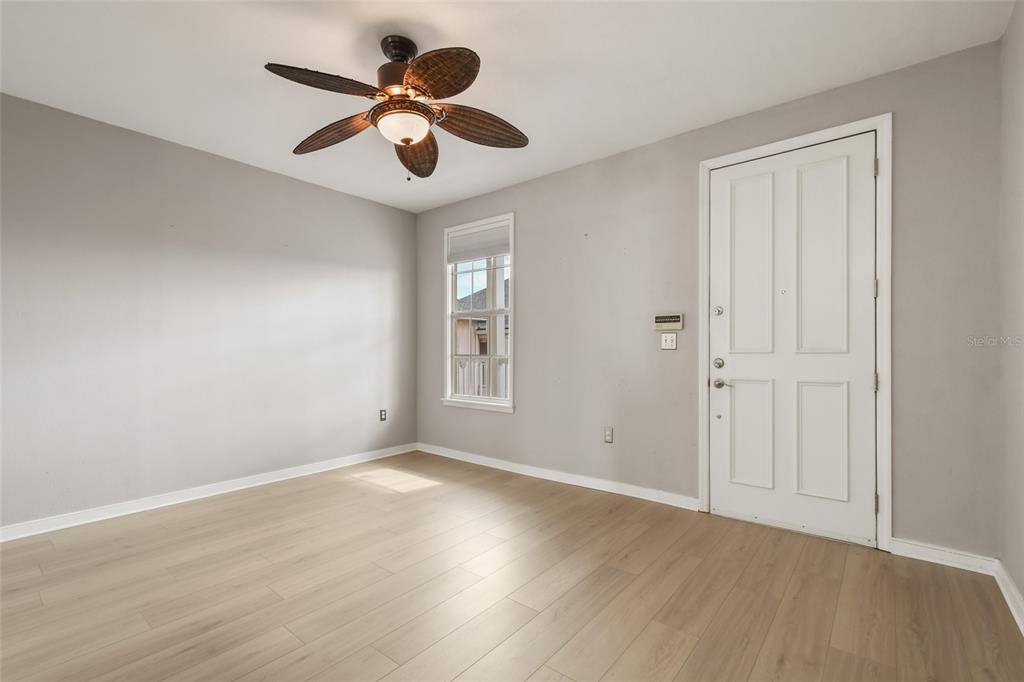 600 Market Street, Unit 340 Celebration, FL 34747 - Photo 4 of 35 wooden floor in an empty room with a window