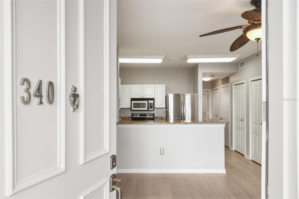 600 Market Street, Unit 340 Celebration, FL 34747 - Photo 7 of 35 a view of a kitchen with a refrigerator and a stove