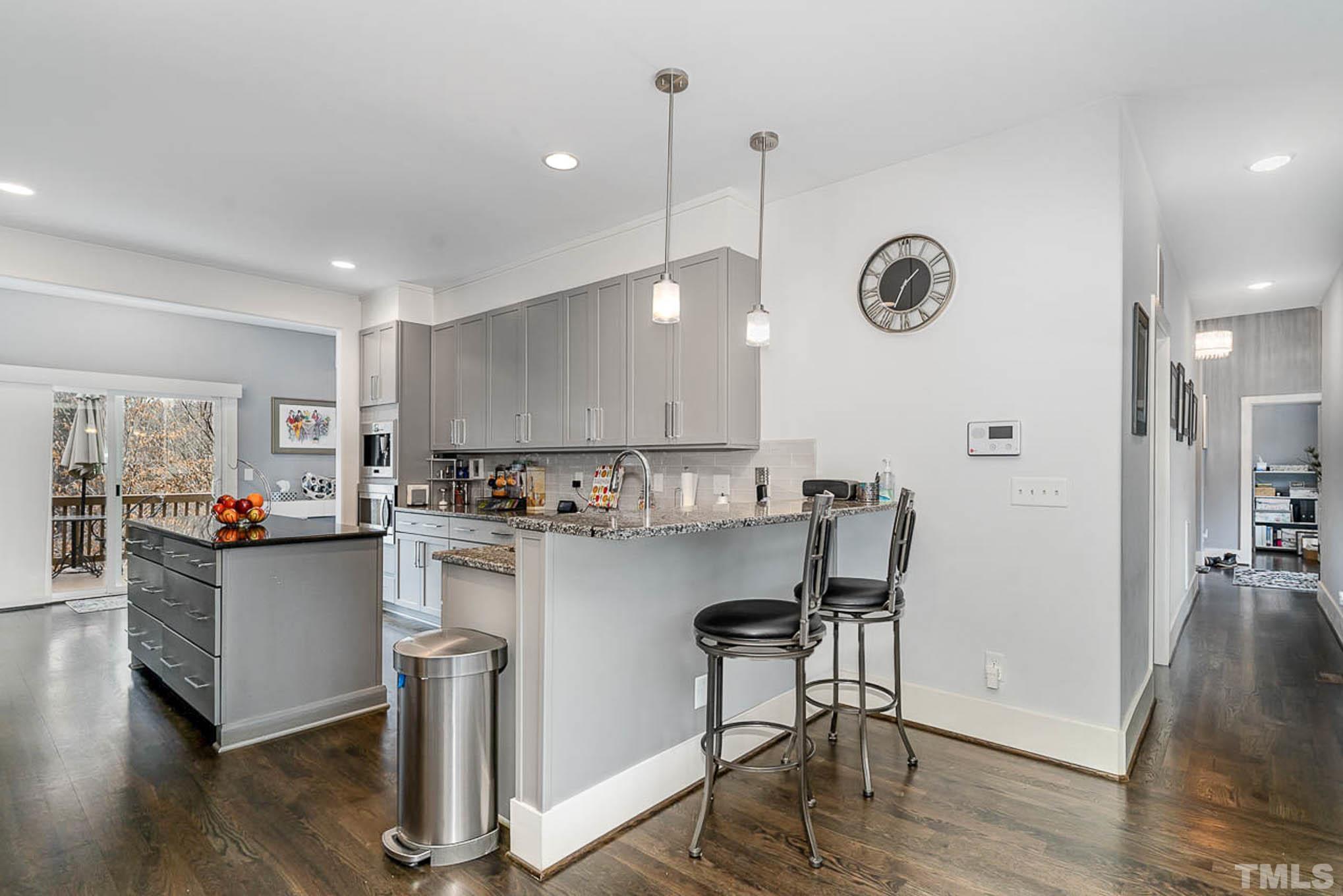 6050 Ebenezer Church Road Raleigh, NC 27612 - Photo 12 of 39 a kitchen with a table and chairs in it