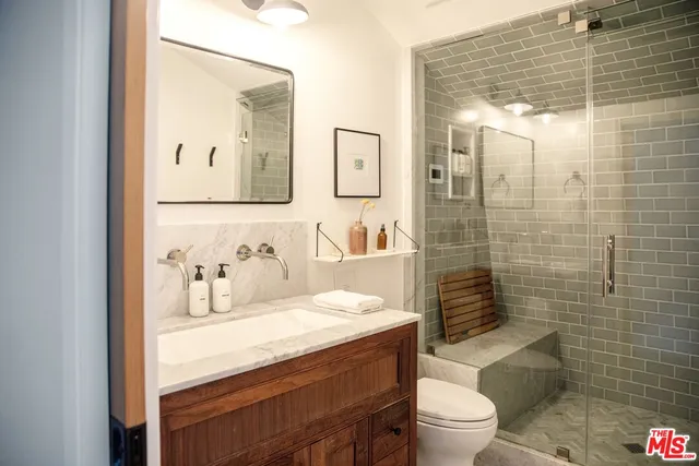 a bathroom with a sink and vanity