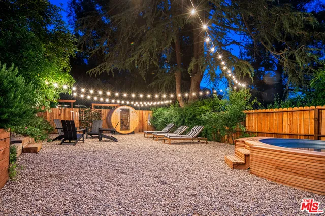 a view of outdoor space with seating area and trees