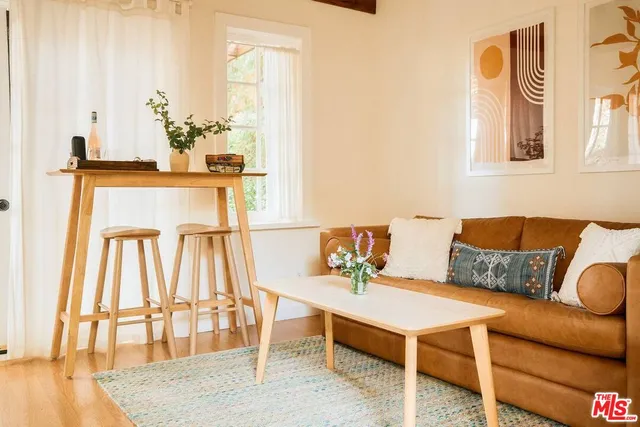an aerial view of residential house with outdoor space and trees all around