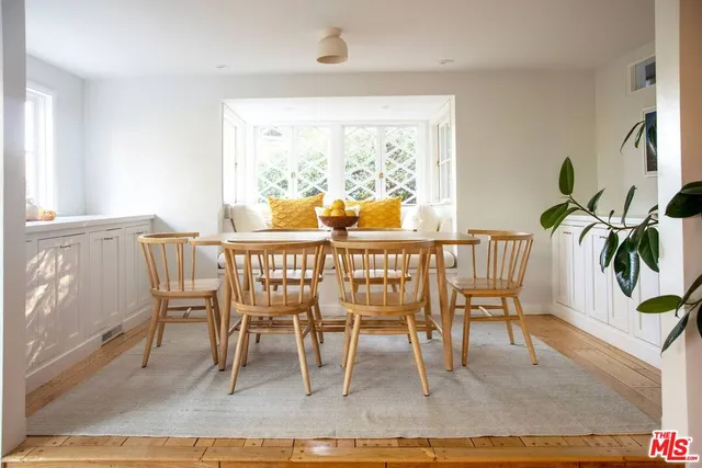 a kitchen with a sink stove top oven and cabinets