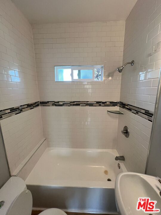 1217 Cedar Avenue Long Beach, CA 90813 - Photo 13 of 15 a bathroom with a bathtub and a shower