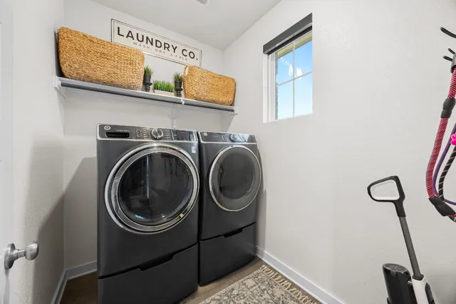 a utility room with dryer and washer