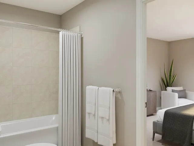 a bedroom with a bed and a mirror