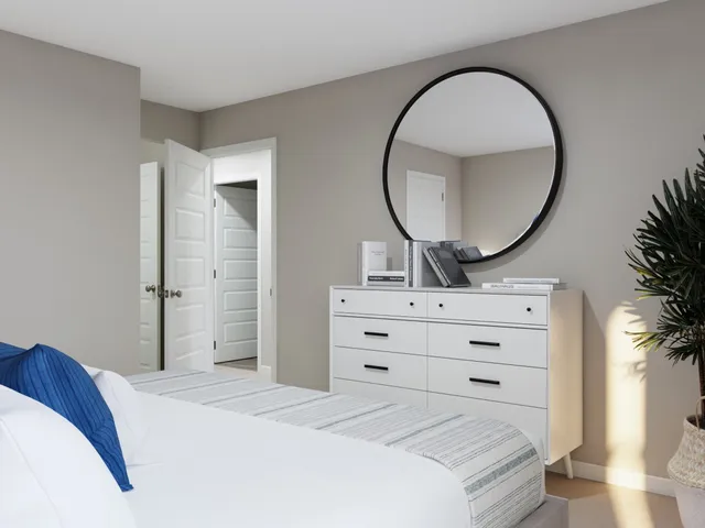 a view of a house with a big yard potted plants and large tree