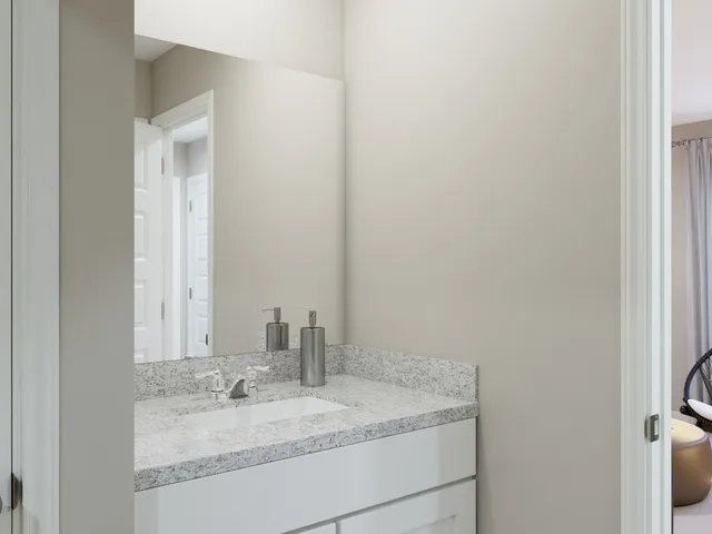 a swimming pool with outdoor seating and outdoor shower