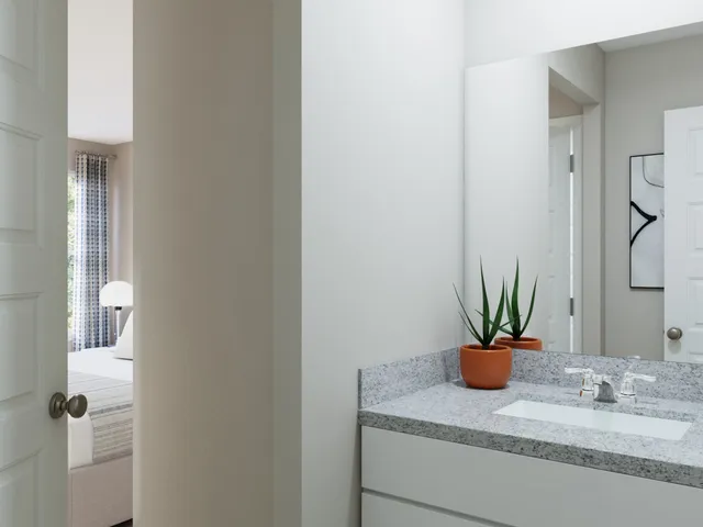 an aerial view of a house with garden space and swimming pool