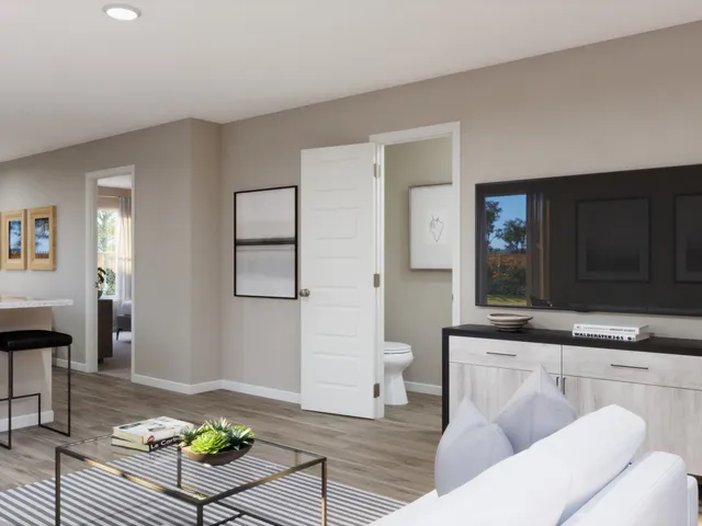 a work room with furniture and a potted plant