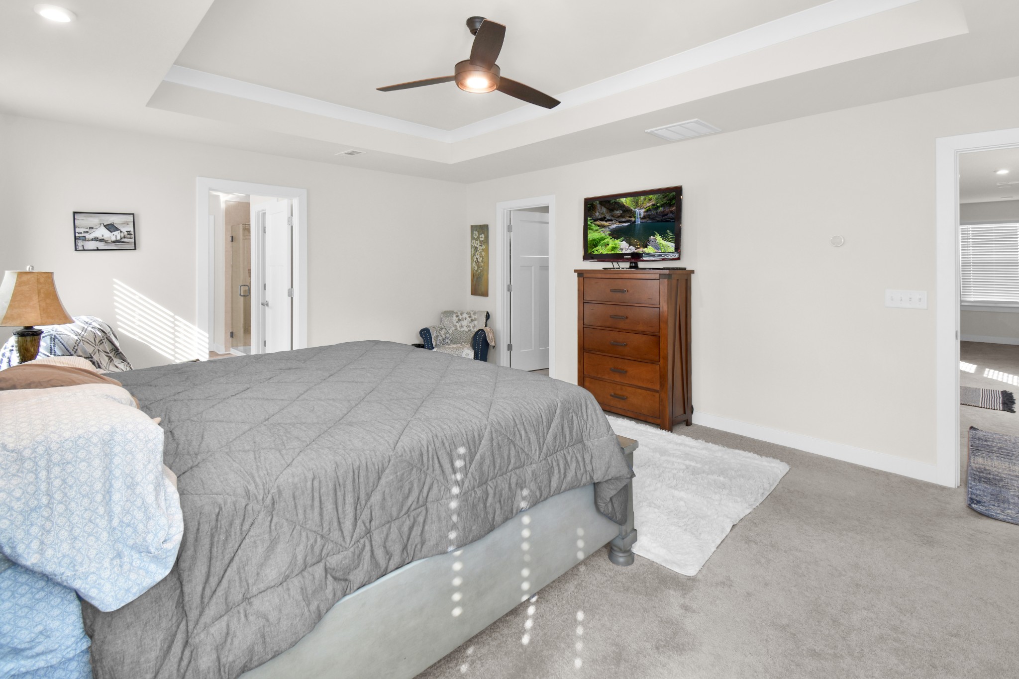 1094 Watermark Way Mount Juliet, TN 37122 - Photo 14 of 29 a spacious bedroom with a bed and a walk in closet