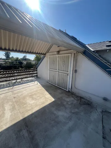a view of outdoor space with wooden floor and outdoor seating