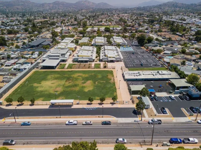 an aerial view of residential houses and outdoor space
