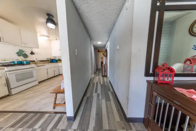a view of a kitchen from the hallway