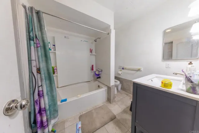 a bathroom with a sink a bathtub and a shower