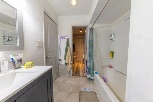 a bathroom with a sink and a shower