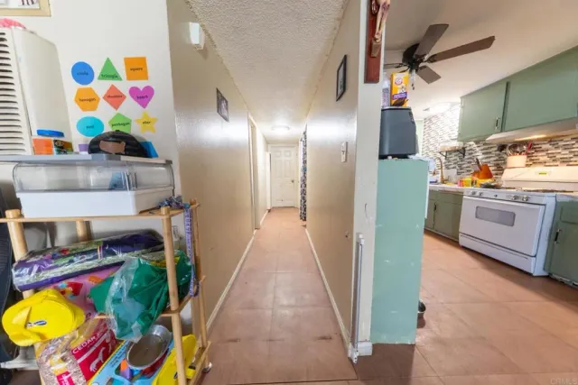 a kitchen that has a lot of stuff and a stove