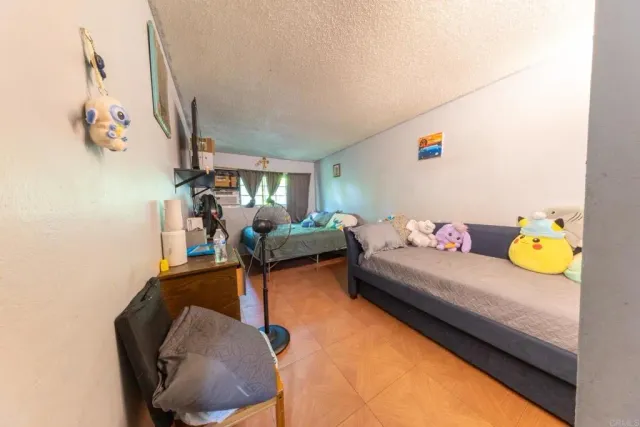 a bedroom with furniture and a couch