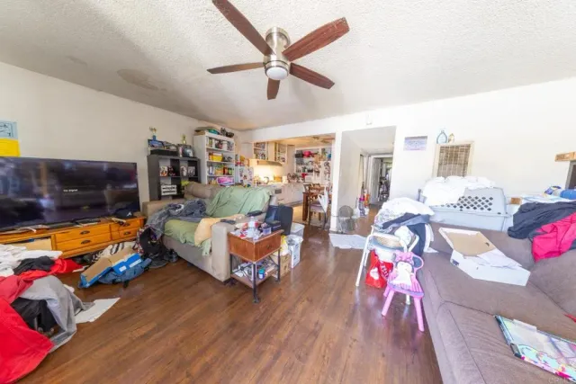 a bed room with furniture and a flat screen tv