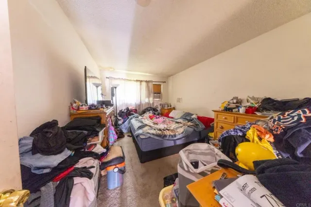 a gym room with furniture and a window