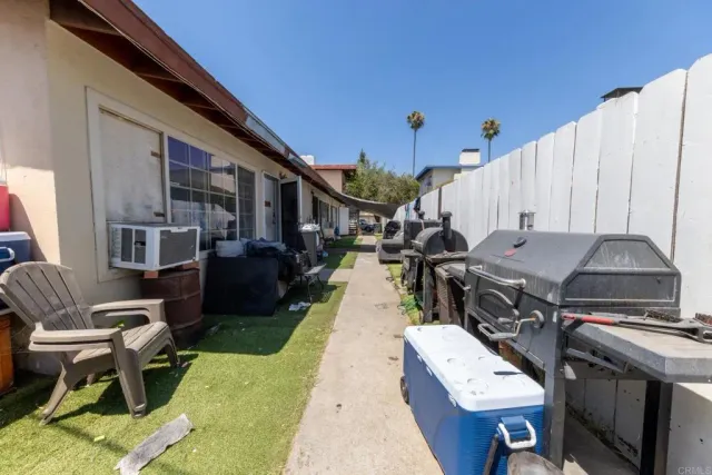 a roof deck with table and chairs