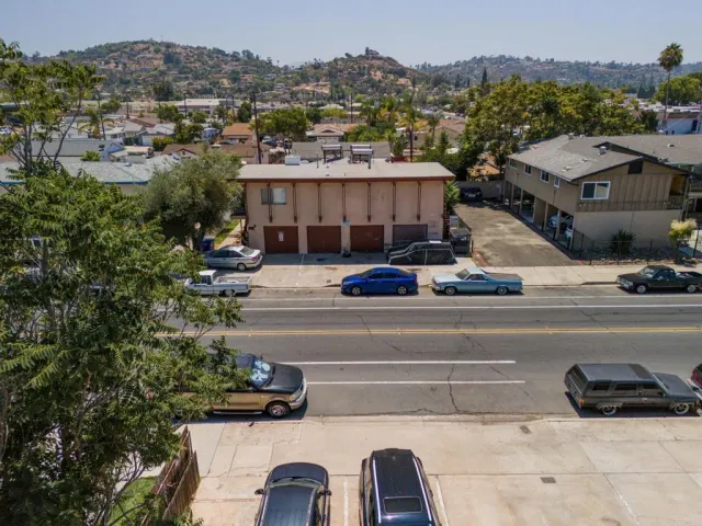 a view of multiple houses with a street